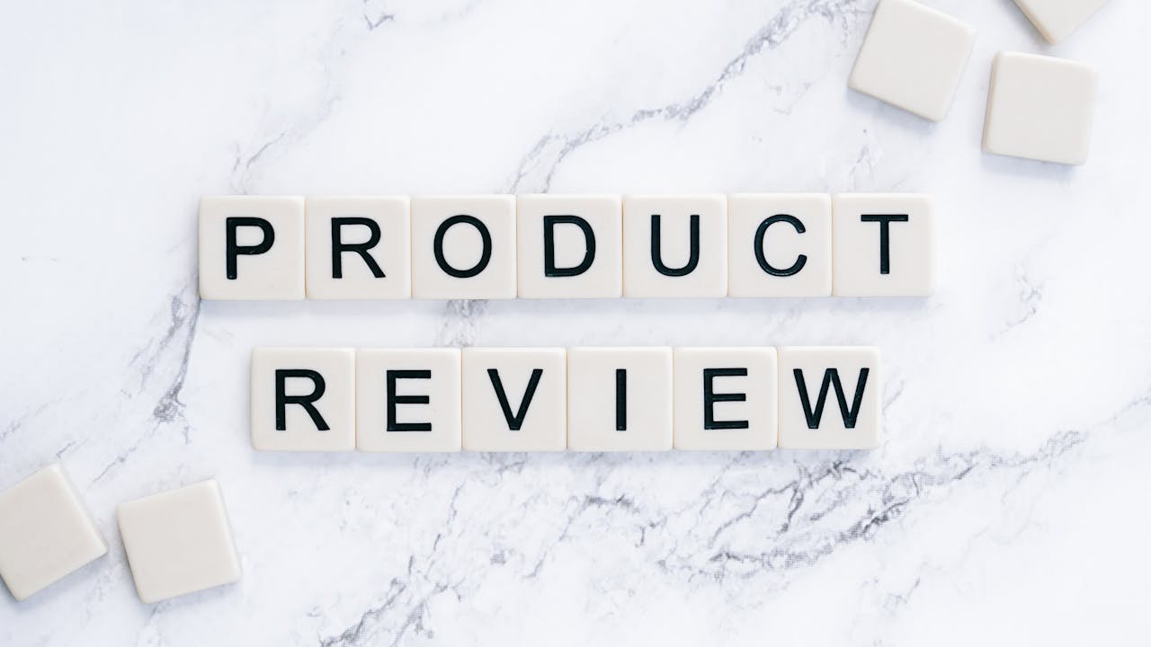 Mastering the First Impression: Your intriguing post title goes here Scrabble tiles spelling 'Product Review' on a marble surface for conceptual illustration.